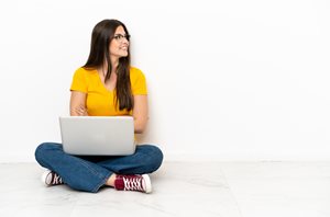 woman smiling using a laptop